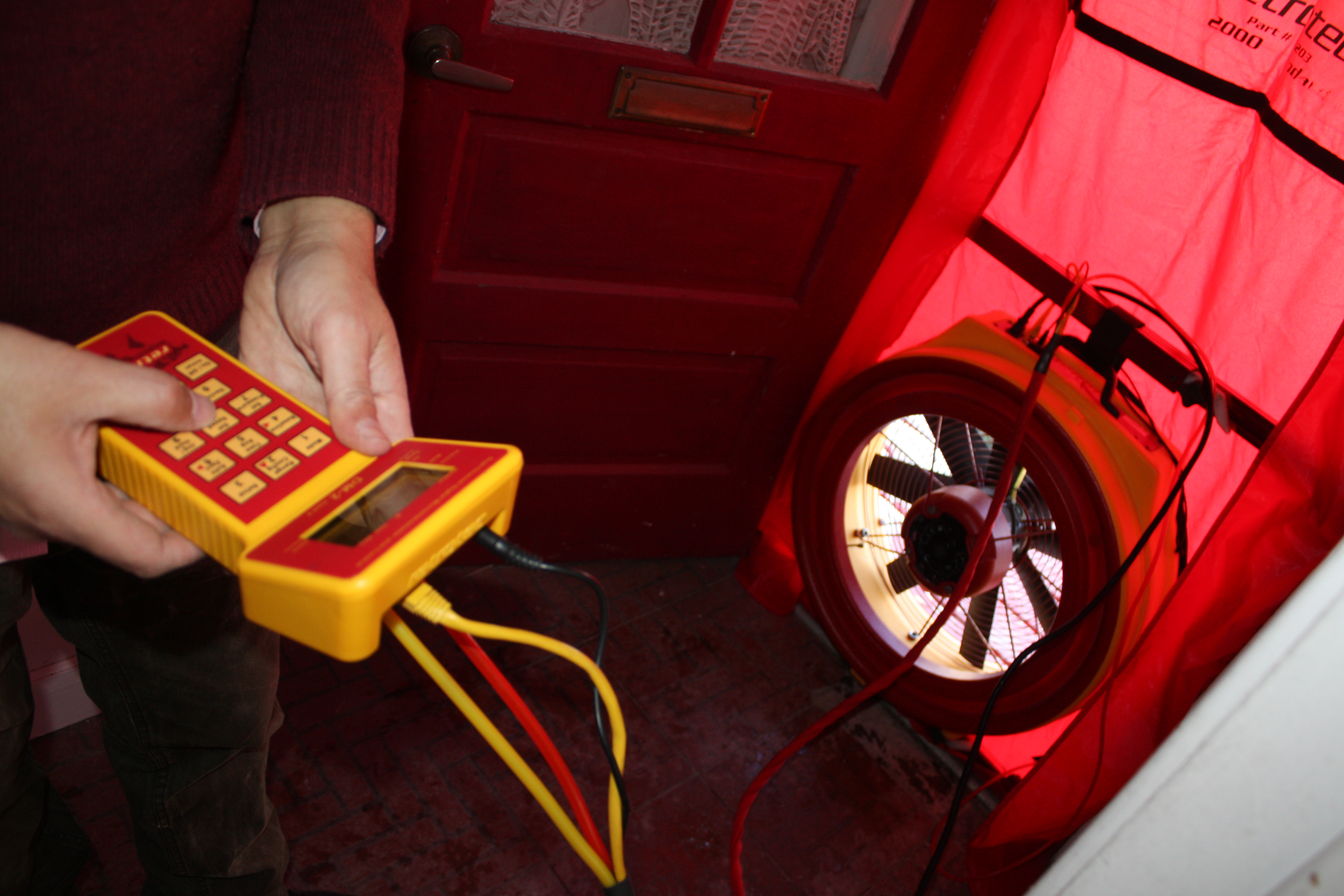 Blower Door Testing on Net-zero Toronto Semi-detached Retrofit